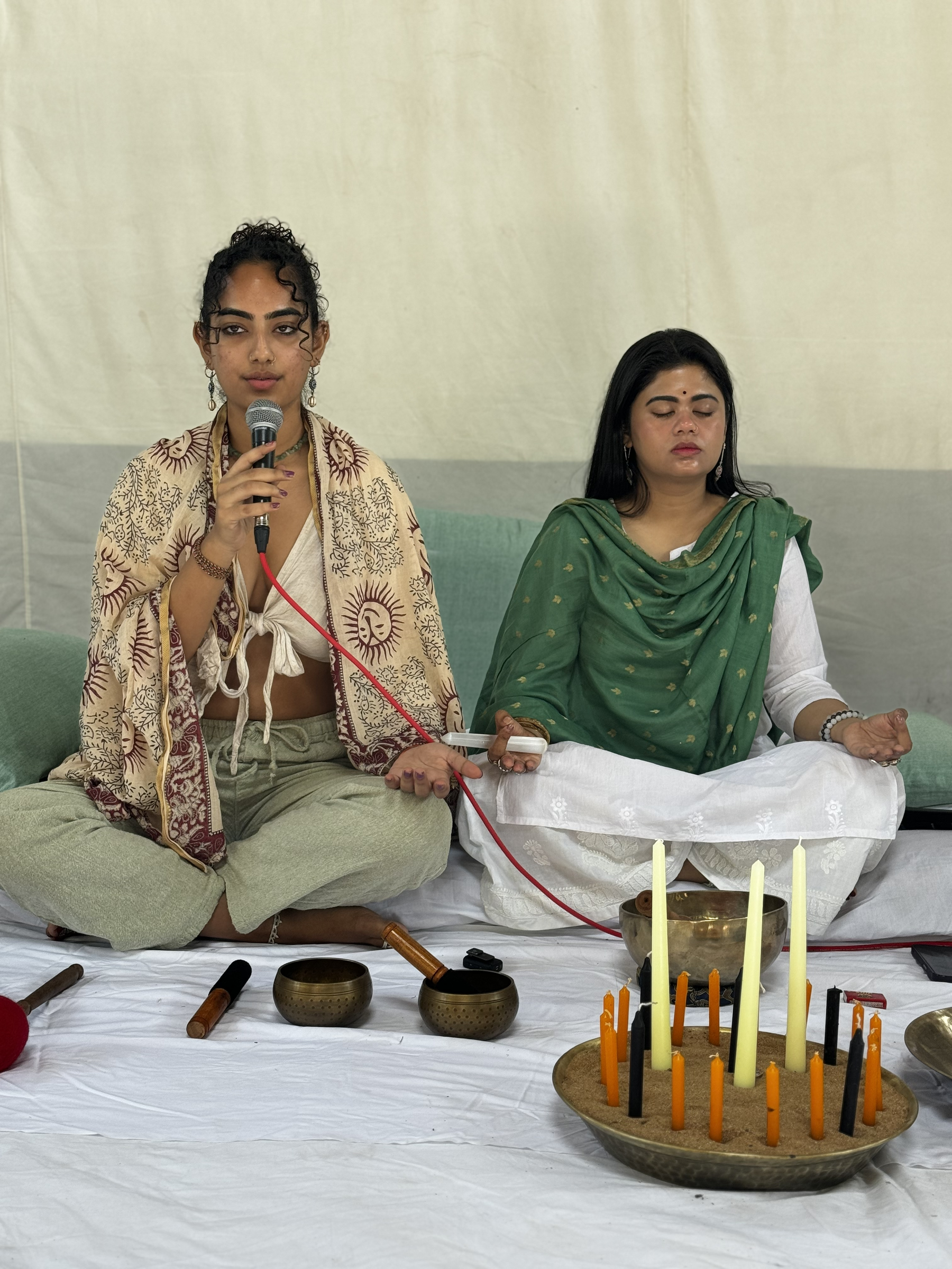 UMA guiding a meditation beside Tibetan sound bowls
